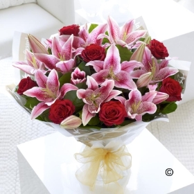 Red Rose and Pink Lily Hand tied with Champagne*