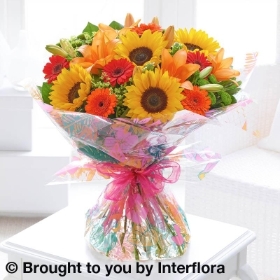 Seasonal Splendour Sunflower and Lily Hand tied with 125g Maison Fougere Chocolates